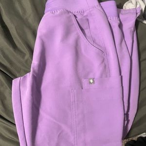 Purple scrub pants.
